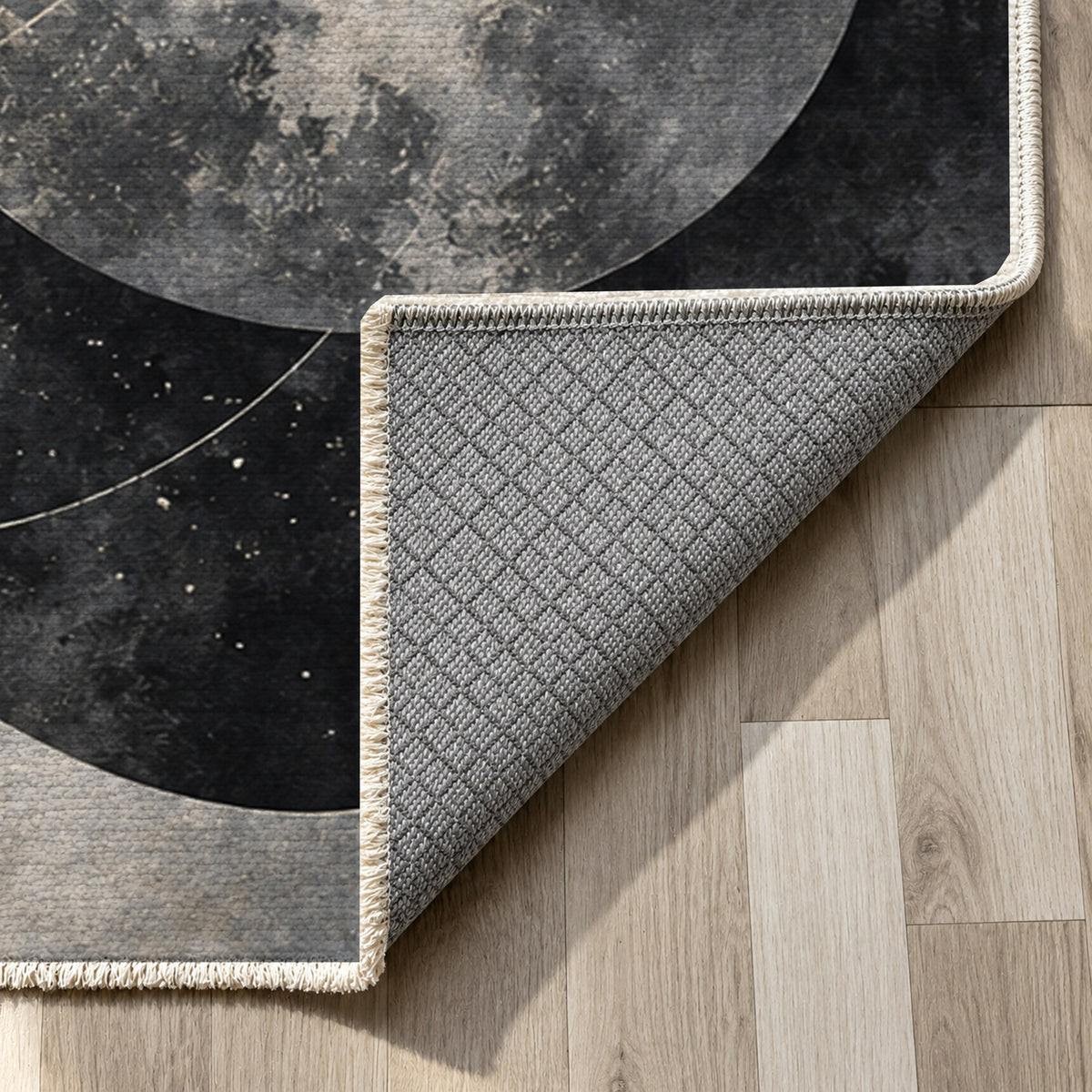 Celestial Orbits Charcoal Abstract Washable Rug — backing close up