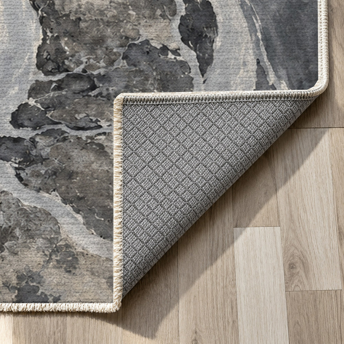 Delta At Dawn Charcoal Abstract Washable Rug — backing close up