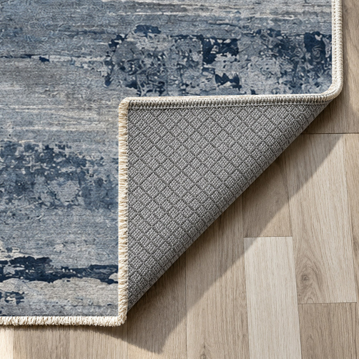 Eroded Strata Blue Grey Abstract Washable Rug — backing close up