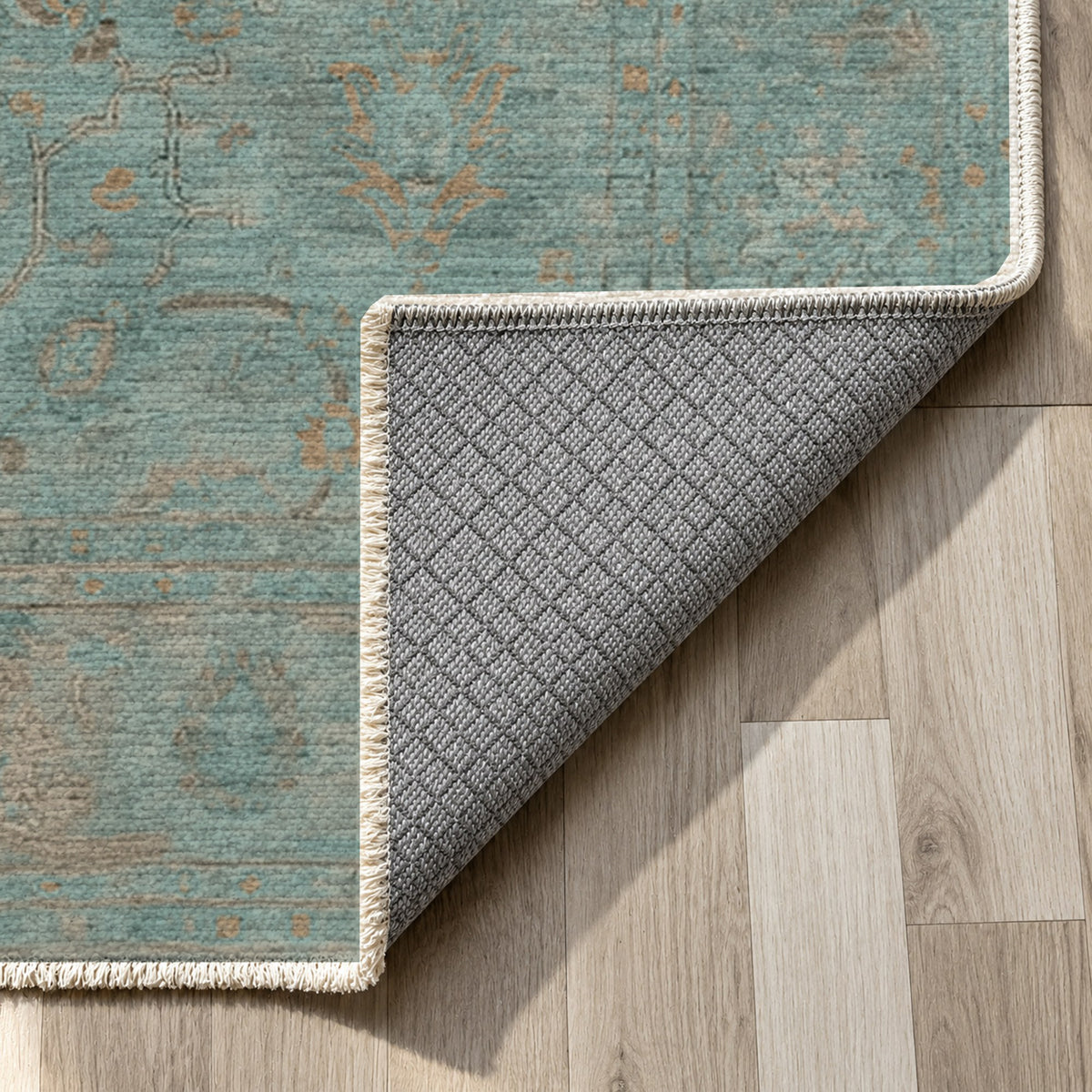 Faded Bloom Teal Vintage Washable Rug — backing close up