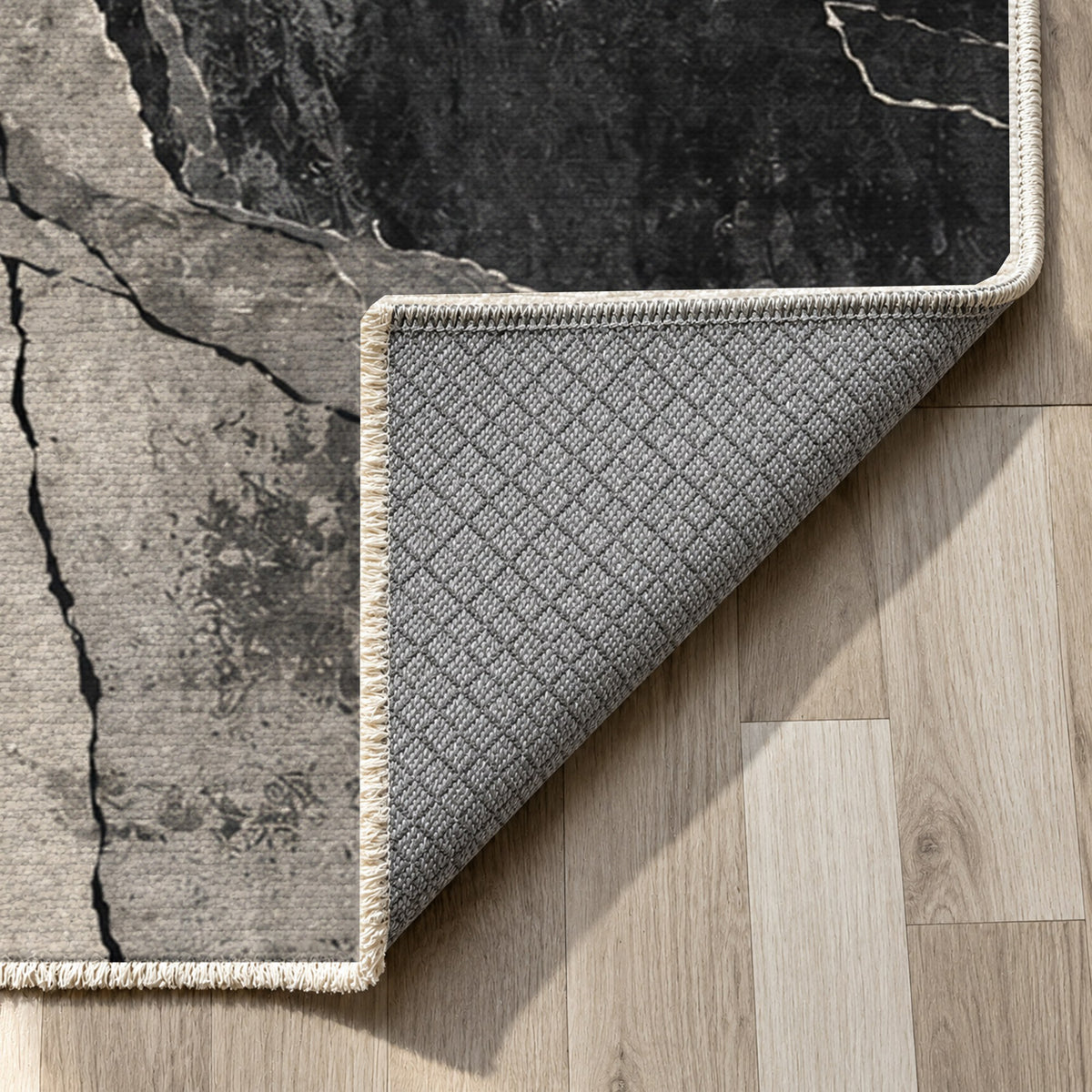 Fault Lines Charcoal Abstract Washable Rug — backing close up