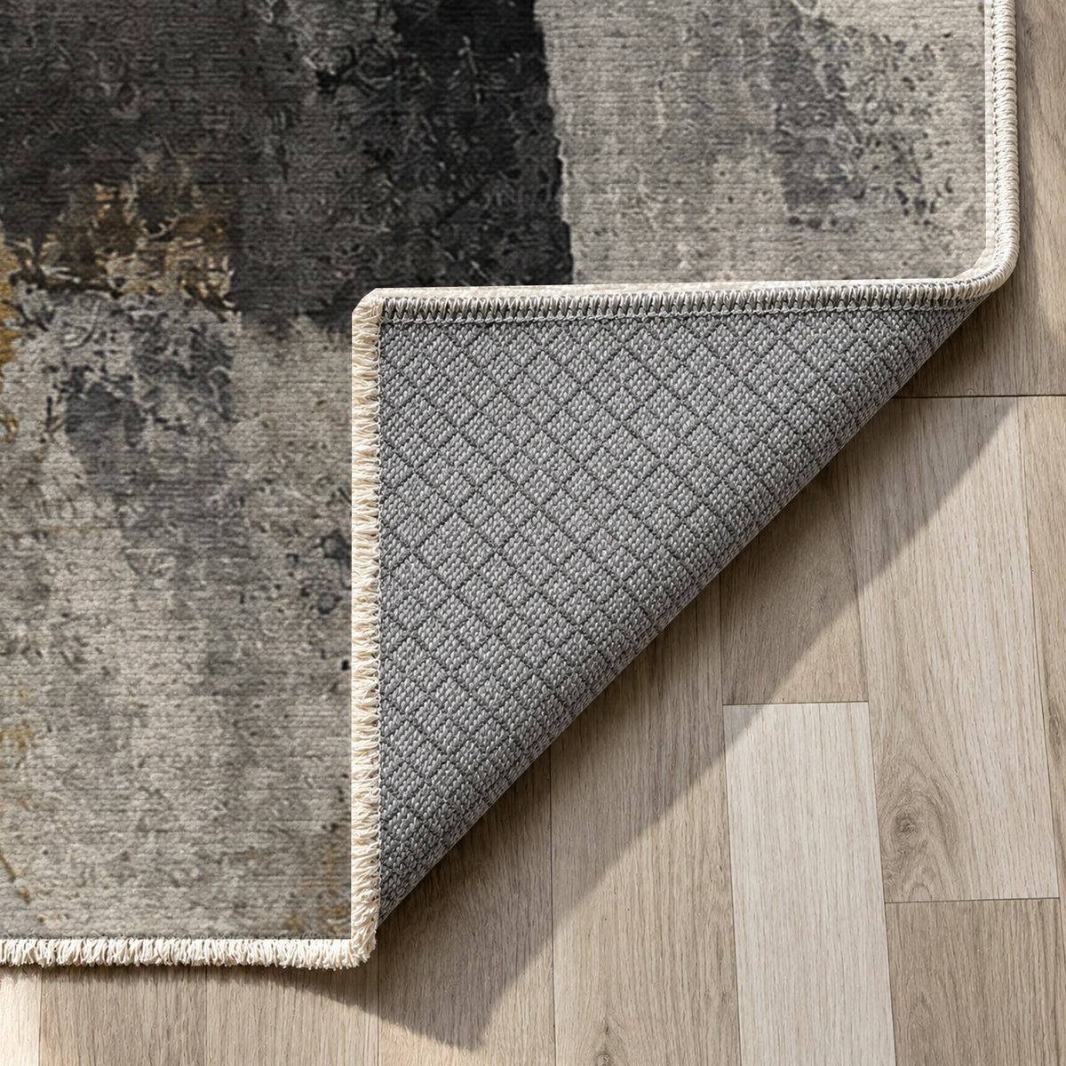 Fractured Light Charcoal Gold Abstract Washable Rug — backing close up