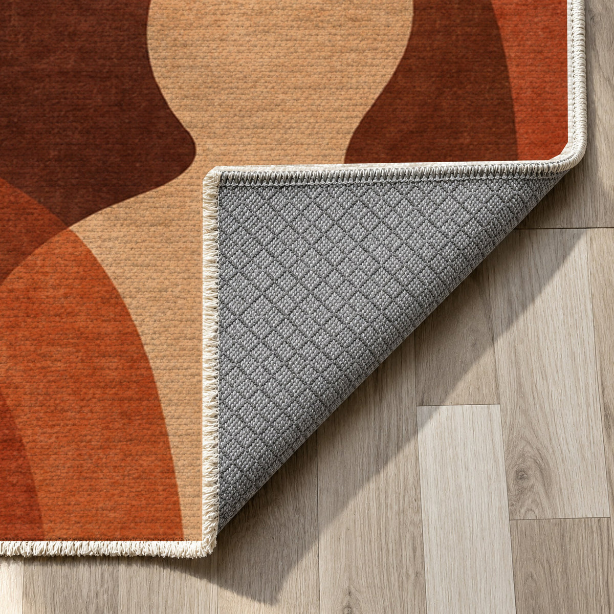 Gathering Shapes Terracotta Abstract Washable Rug — backing close up