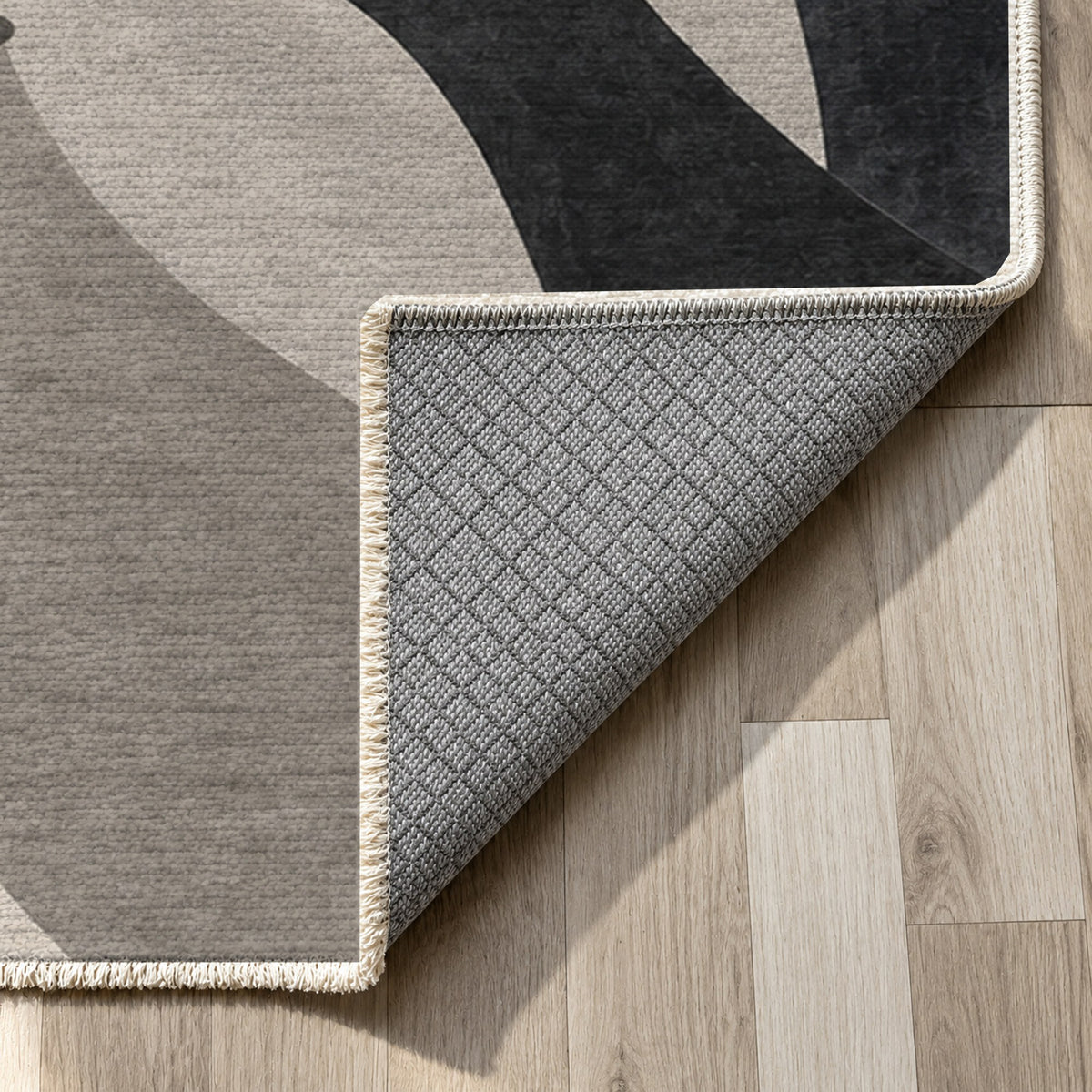 Hands In Harmony Charcoal Abstract Washable Rug — backing close up