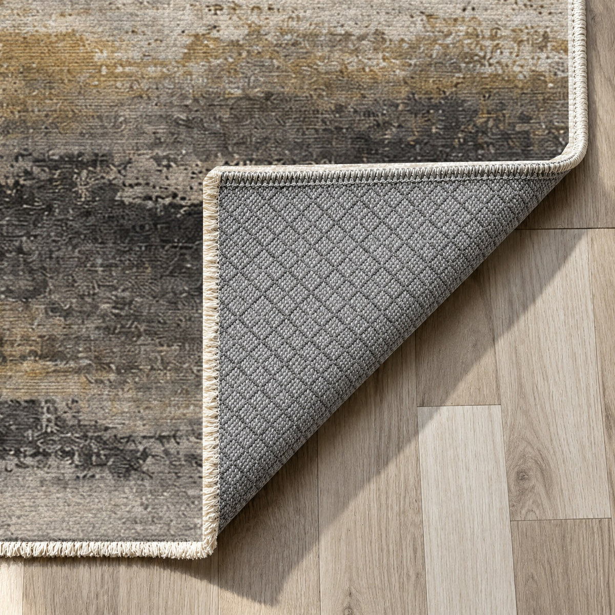 Himalayan Haze Charcoal Gold Abstract Washable Rug — backing close up