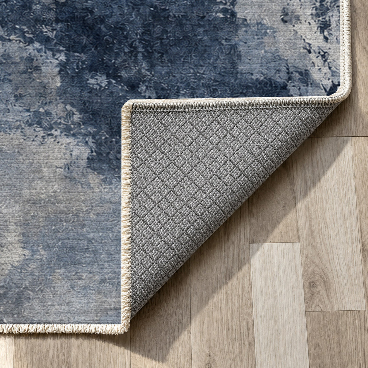 Ink River Blue Grey Abstract Washable Rug — backing close up