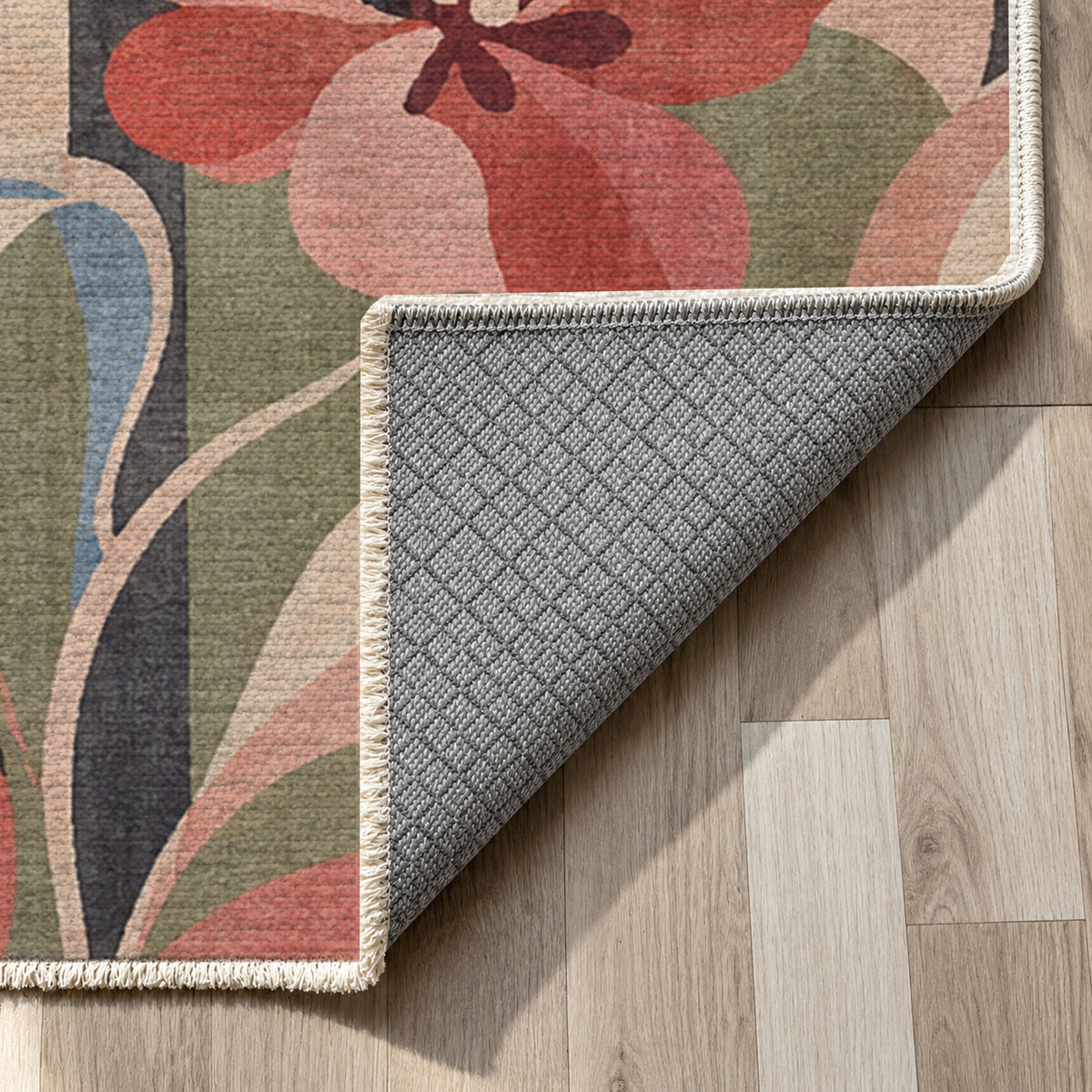 Monstera Coral Floral Washable Rug — backing close up