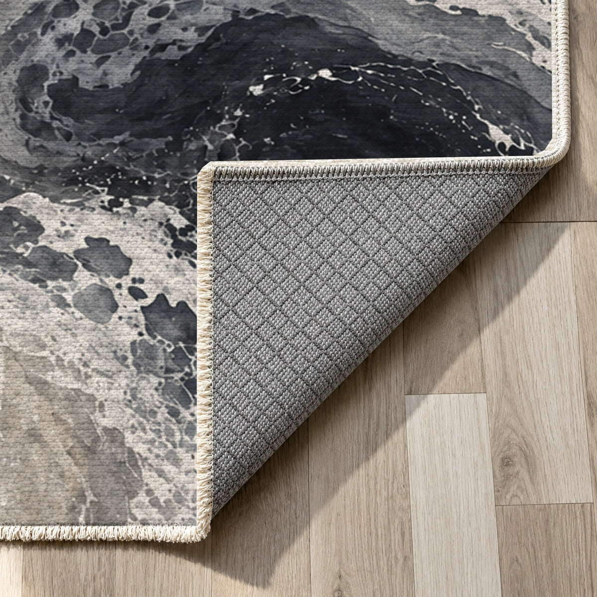 Ocean Currents Charcoal Abstract Washable Rug — backing close up