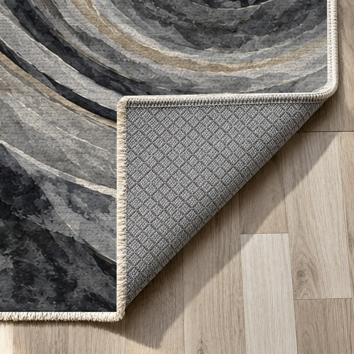 Ocean Rings Charcoal Abstract Washable Rug — backing close up