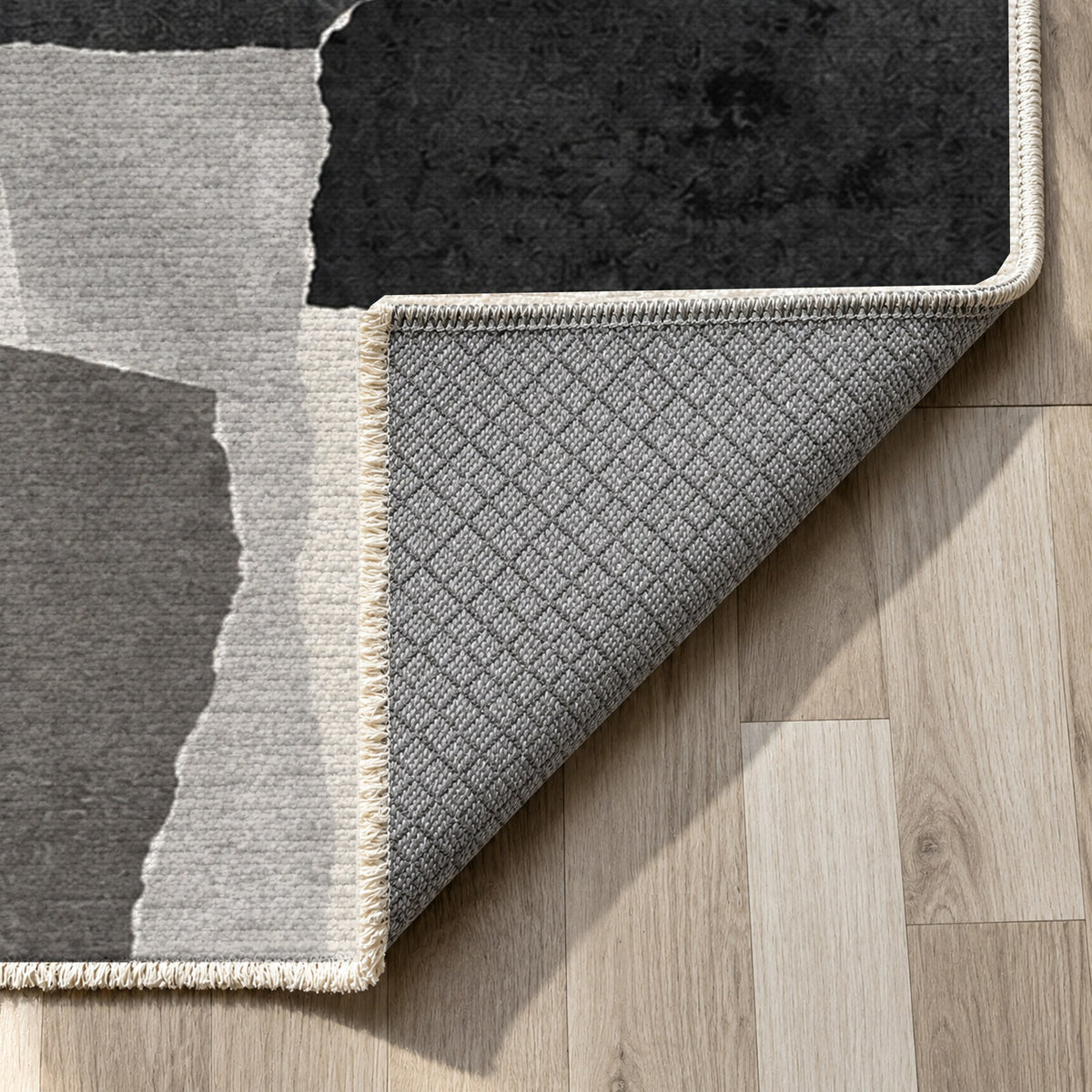 Paper Collage Charcoal Ivory Modern Washable Rug — backing close up