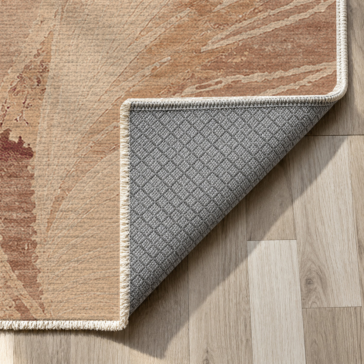Plume Terracotta washable rug — backing close up