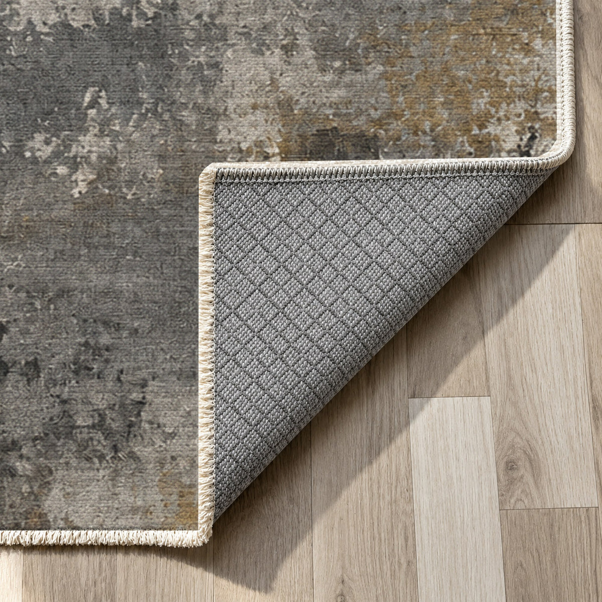 Quiet Horizon Charcoal Gold Abstract Washable Rug — backing close up
