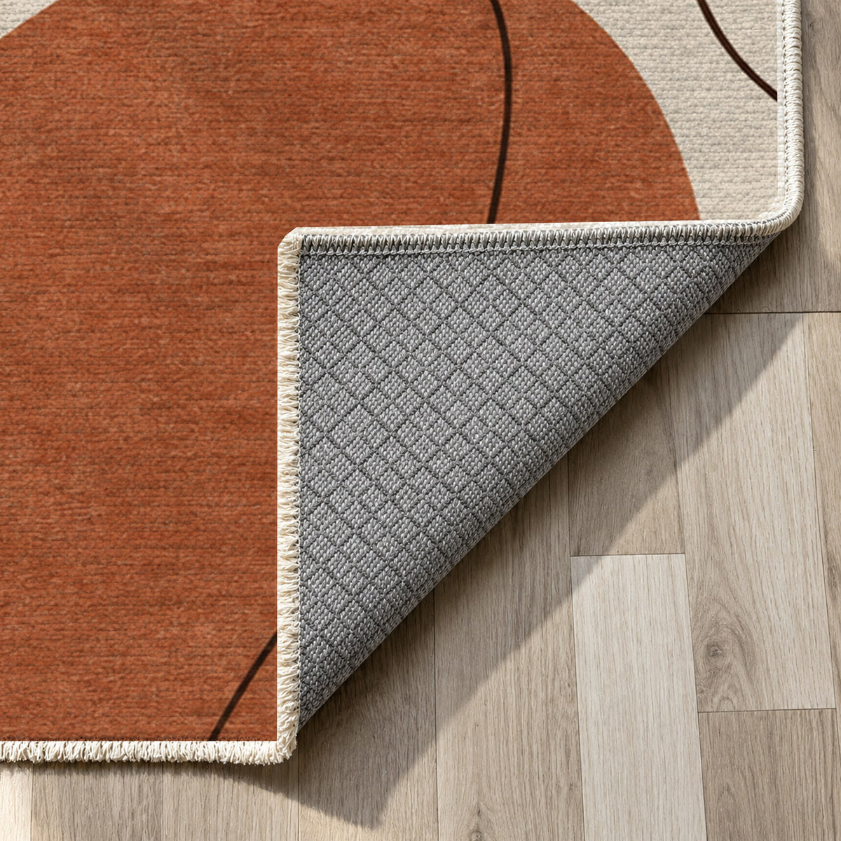 Quiet Profiles Terracotta Abstract Washable Rug — backing close up