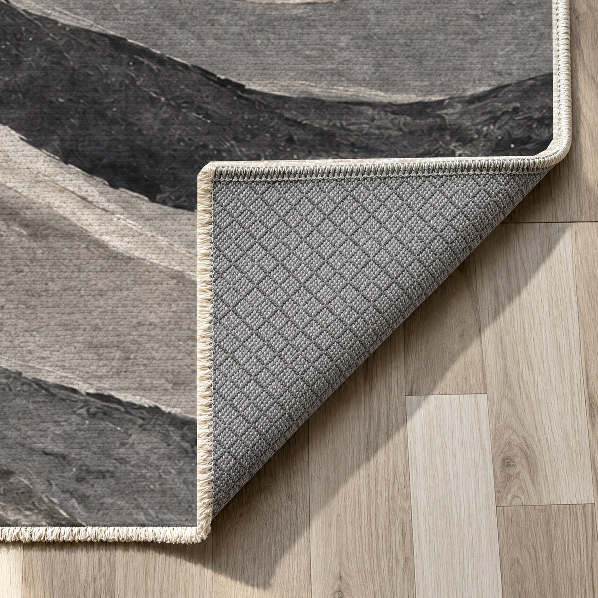 Sandstone Bands Charcoal Abstract Washable Rug — backing close up
