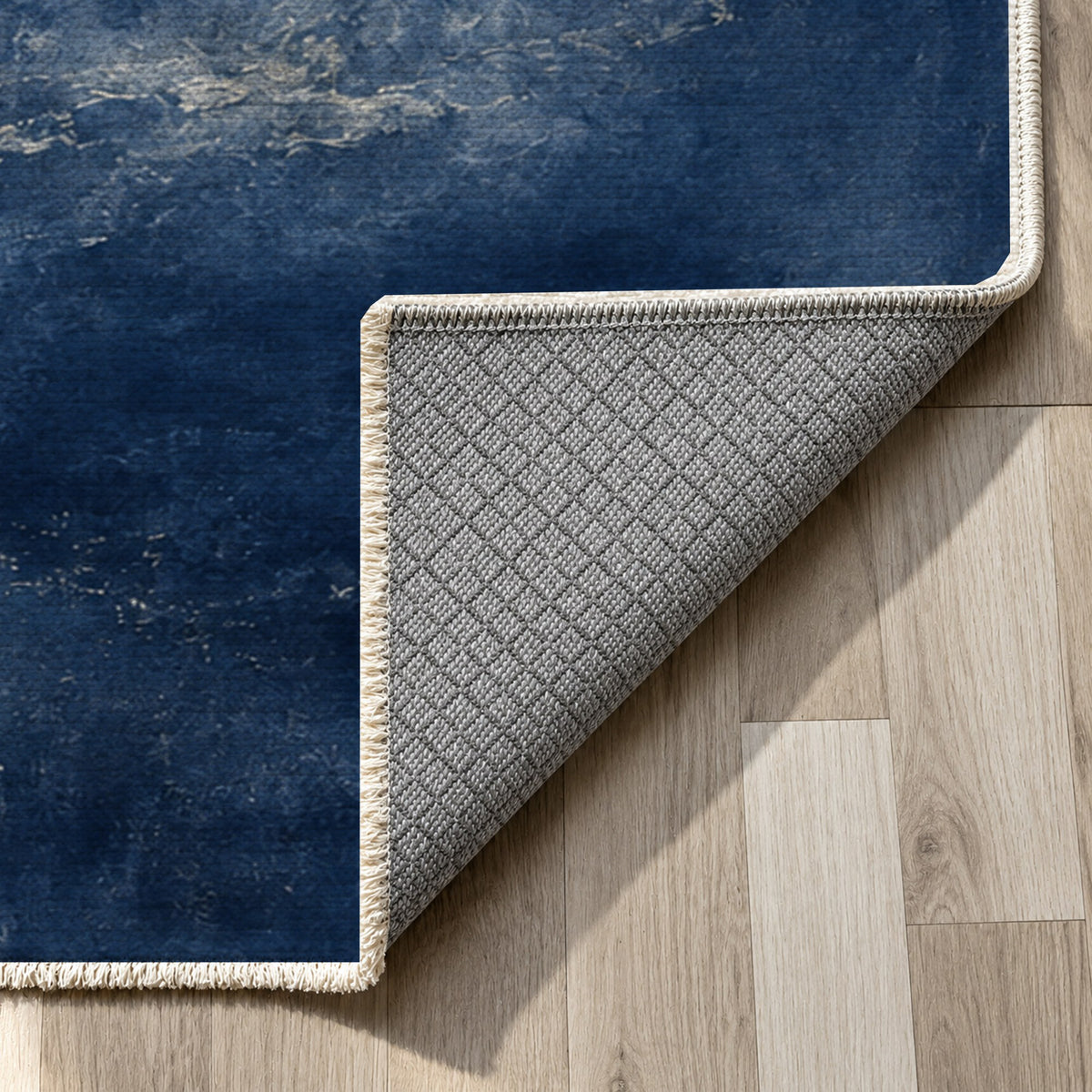 Solar Halo Indigo Abstract Washable Rug — backing close up