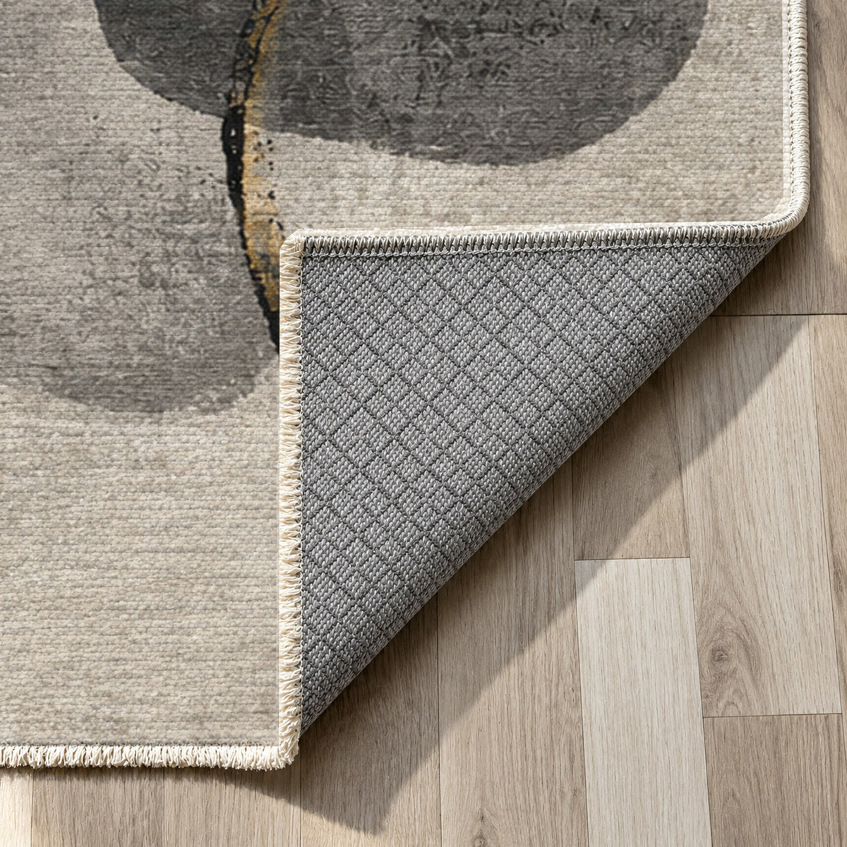 Stone Dialogue Charcoal Gold Abstract Washable Rug — backing close up