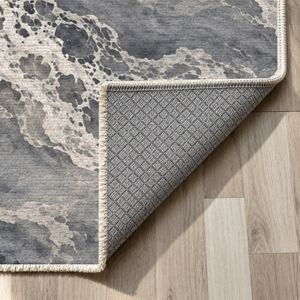 Tidal Lace Charcoal Abstract Washable Rug — backing close up