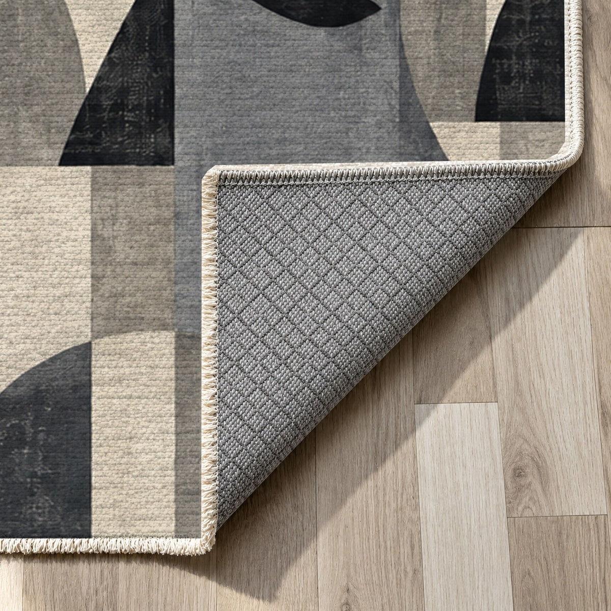 Urban Faces Charcoal Abstract Washable Rug — backing close up