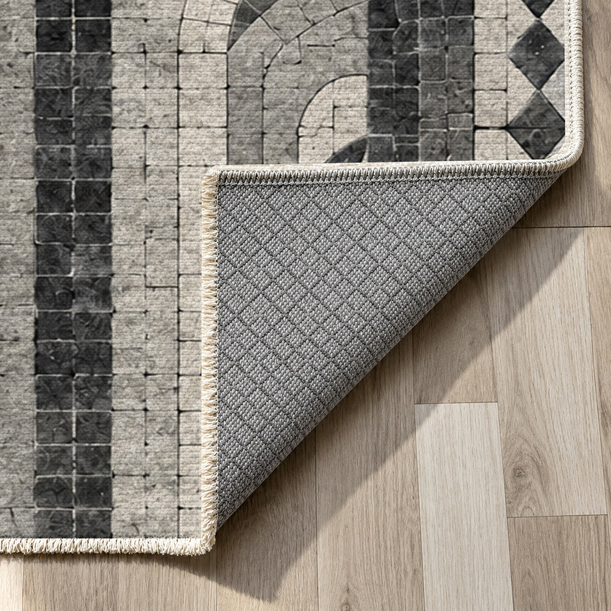 Weathered Arches Charcoal Geometric Washable Rug — backing close up