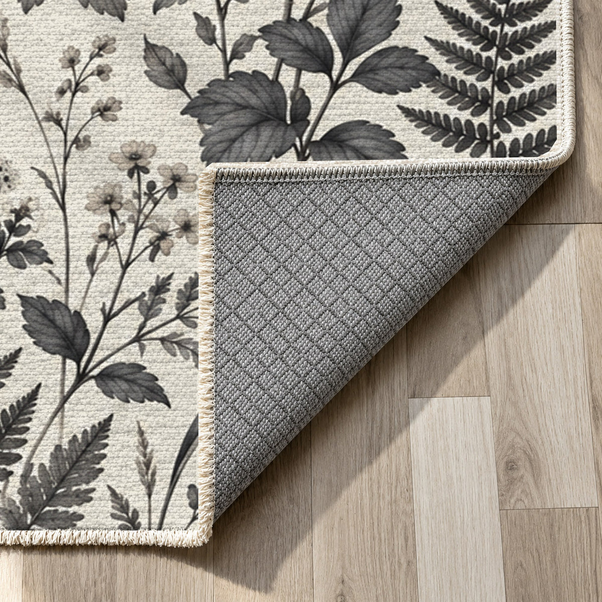 Wildflower Clearing Charcoal Floral Washable Rug — backing close up